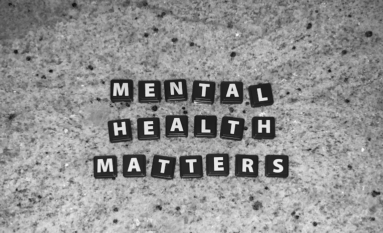 Wooden letter tiles spelling mental health matters, symbolising student mental health support