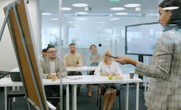 Young trainee in workplace training session, representing UK apprenticeships