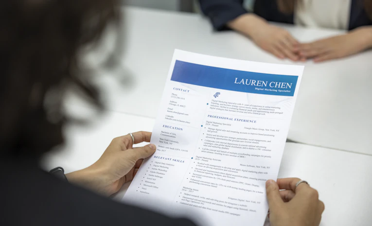 Person reviewing a CV document, representing CV writing tips