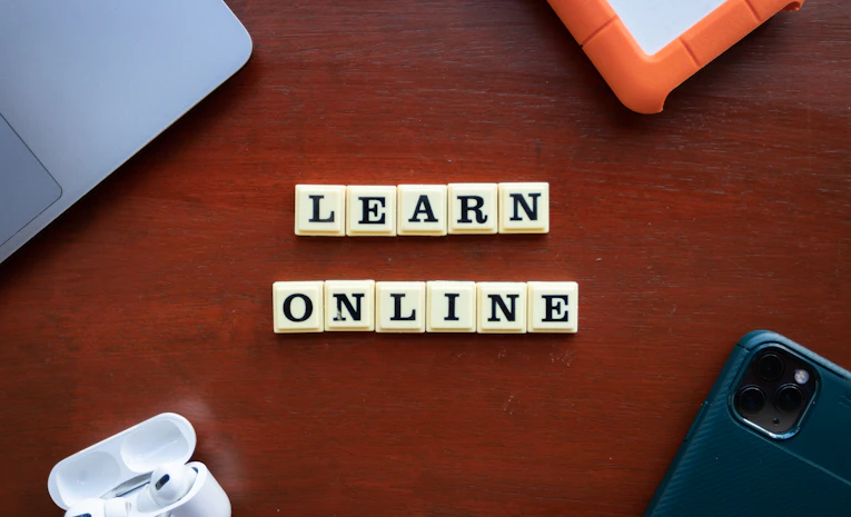 Scrabble tiles spelling learn online, representing UK distance learning