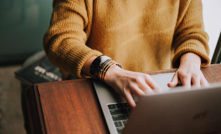 Person studying flexibly on a laptop at home, representing the Open University