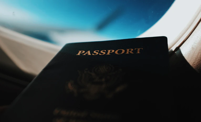Silhouette of a passport against an airplane window, representing the UK student visa